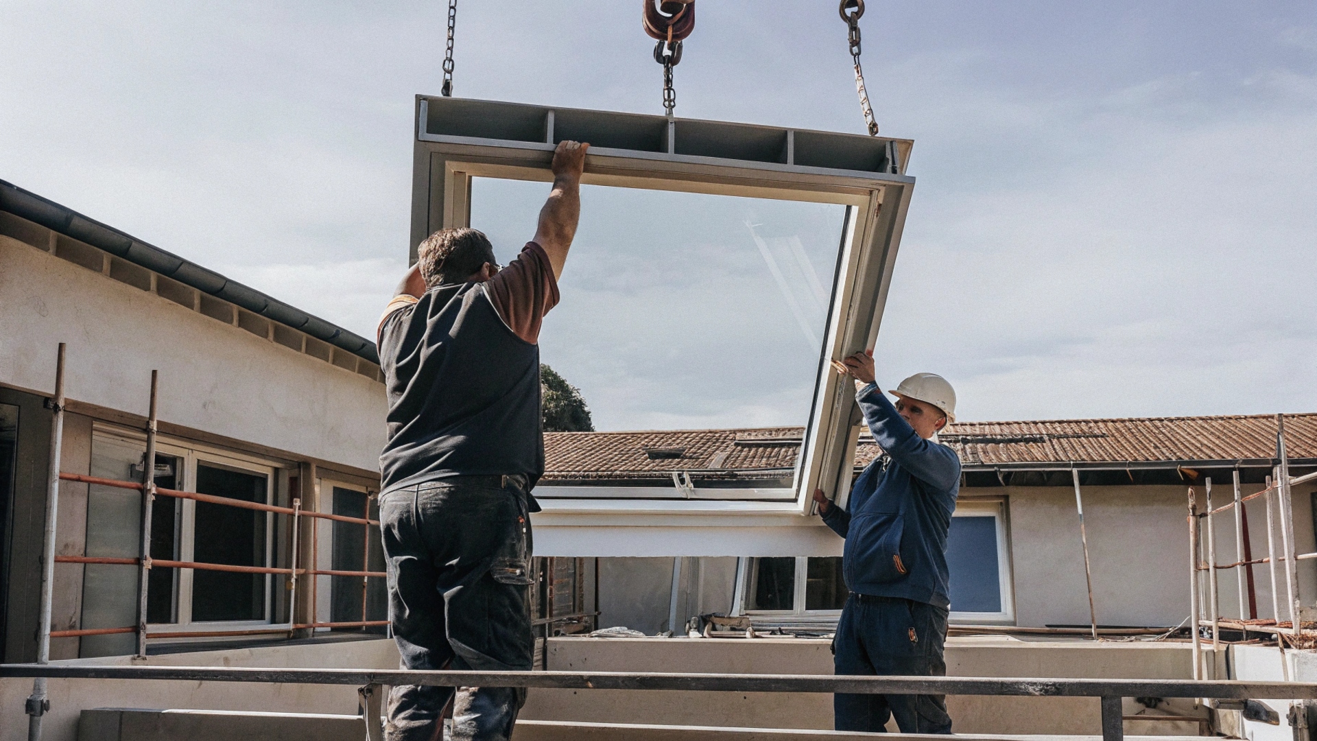 hoisting-window-frames-to-install-in-office-buildi (1)